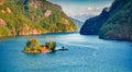 Superb summer view of Lovrafjorden flord with small island and typical Norwegian building, North sea.