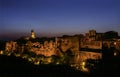 Superb view of the village built on the tuff of Pitigliano, Grosseto, Tuscany, Italy, illuminated by the evening light Royalty Free Stock Photo