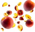 Superbly retouched whole peaches and slices fly and levitate in space. Selective focus. Isolated on white Royalty Free Stock Photo