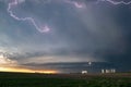 Lightning in the anvil of a supercell thunderstorm with an ufo mothership wallcloud Royalty Free Stock Photo