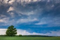 Supercell storm clouds with wall cloud and intense rain Royalty Free Stock Photo