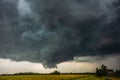 Supercell storm clouds with wall cloud and intense rain Royalty Free Stock Photo