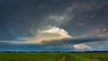 Supercell storm clouds with wall cloud and intense rain Royalty Free Stock Photo