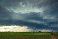 Supercell storm clouds with wall cloud and intense rain Royalty Free Stock Photo