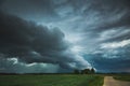 Supercell storm clouds with wall cloud and intense rain Royalty Free Stock Photo