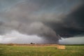 A supercell storm with a low shelf cloud hangs ominously over farmland in Nebraska. Royalty Free Stock Photo