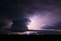 Supercell thunderstorm illuminated by lightning Royalty Free Stock Photo