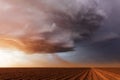 Supercell thunderstorm with inflow dust at sunset