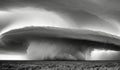 A supercell thunderstorm, presence of a mesocyclone. Moisture streams in from the side of the precipitation-free base