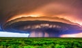 A supercell thunderstorm, presence of a mesocyclone. Moisture streams in from the side of the precipitation-free base