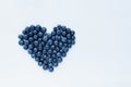 Superfood blueberries formed into a heart shape. Healthy food, summer berries. Minimal food concept. Flatlay. Selective Royalty Free Stock Photo