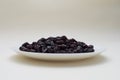 Superfood Dried Cranberries On White Plate On Beige Background. Copy Space For Text
