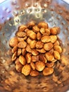 Metal Bowl of Roasted Sacha Inchi Seeds, known as Inca Nuts