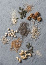 Superfood ingredients. Assortiment seeds and nuts on a gray background, top view. Flax seeds, sesame seeds, walnuts, sunflower see Royalty Free Stock Photo