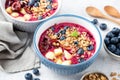 Superfood smoothie bowl with granola and berry topping