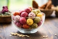superfood snack balls in a glass bowl on wooden table