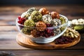 superfood snack balls in a glass bowl on wooden table