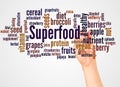 Superfood word cloud and hand with marker concept