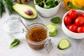 Superfoods and homemade salad dressing vinaigrette with mustard, honey, balsamic vinegar and olive oil on a stone or slate Royalty Free Stock Photo