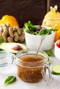 Superfoods and homemade salad dressing vinaigrette with mustard, honey, balsamic vinegar and olive oil on a stone or slate Royalty Free Stock Photo