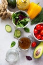 Superfoods and homemade salad dressing vinaigrette with mustard, honey, balsamic vinegar and olive oil on a stone or slate Royalty Free Stock Photo