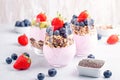 Superfoods layered pudding with granola, blueberry and strawberry in glasses. Yogurt with chia seeds, berries, kiwi and