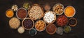 Superfoods, legumes, nuts, seeds and cereals set in bowls on wooden background. Superfood as chia, spirulina, beans, goji berries