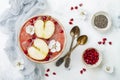 Superfoods smoothie bowl with chia seeds, pomegranate, sliced apples and honey. Overhead, flat lay. Rosh Hashana traditional food