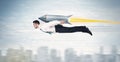 Superhero business man flying with jet pack rocket above the cit Royalty Free Stock Photo