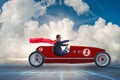 The superhero businessman driving vintage roadster Royalty Free Stock Photo