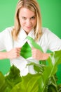 Superhero Businesswoman confident face green plant