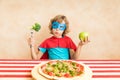 Superhero child eating superfood Royalty Free Stock Photo