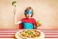 Superhero child eating superfood Royalty Free Stock Photo