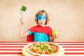 Superhero child eating superfood Royalty Free Stock Photo