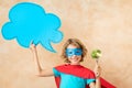 Superhero child eating superfood Royalty Free Stock Photo