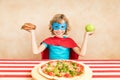 Superhero child eating superfood Royalty Free Stock Photo