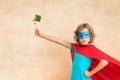 Superhero child eating superfood Royalty Free Stock Photo