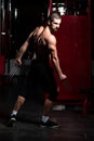 Superhero With Claws Flexing Muscles in Fitness center