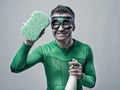 Superhero cleaning with sponge and detergent Royalty Free Stock Photo