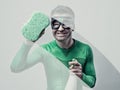 Superhero cleaning with sponge and detergent Royalty Free Stock Photo