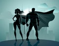 Superhero Couple: Male and female superheroes, posing in front o