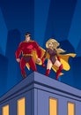 Superhero Couple Roof Watch Royalty Free Stock Photo