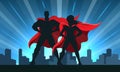 Superhero Couple Silhouette with City Skyline Background Royalty Free Stock Photo