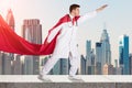 Superhero Doctor Against City Skyline Royalty Free Stock Photo