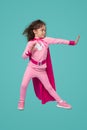 Superhero girl in pink outfit ready to help Royalty Free Stock Photo