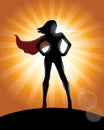 Superhero Girl Standing with Cape Waving in the Wind Silhouette Royalty Free Stock Photo