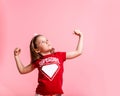 Superhero kid against blue pink background. Girl power concept. Confident child shows muscles. Kindergarten kid ready to Royalty Free Stock Photo