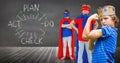 Superhero kids and king crown boy with blackboard background and plan graphics Royalty Free Stock Photo