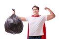 The superhero man with garbage sack isolated on white