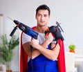 Superhero repairman with tools in repair concept Royalty Free Stock Photo